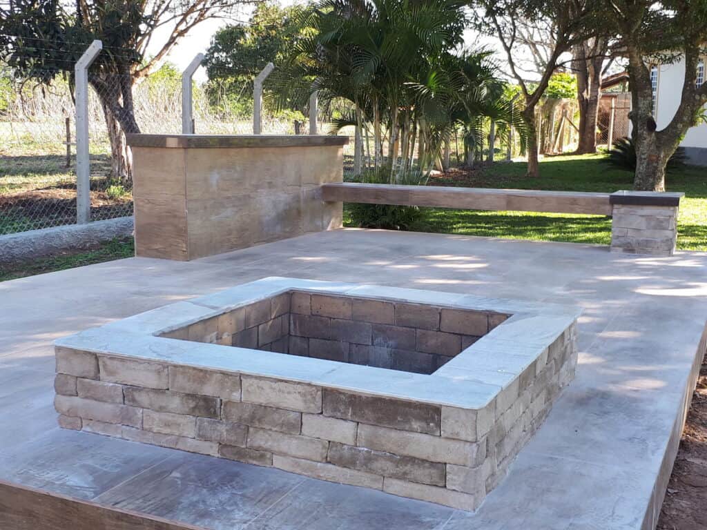 Fire pit made with manufactured stones for outdoor patios and gardens.