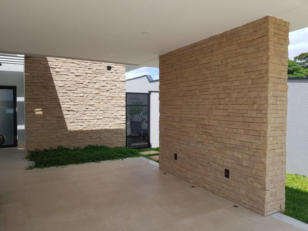 Stone wall accent with manufactured stones for modern outdoor design.
